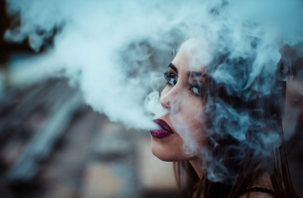 Woman exhaling vapor
